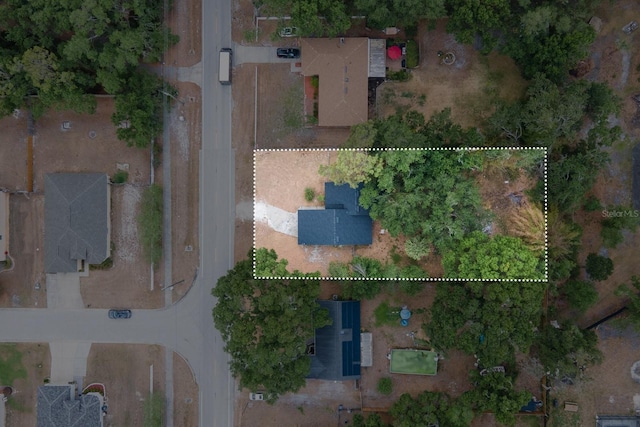 aerial view of property and surrounding area featuring property boundaries highlighted