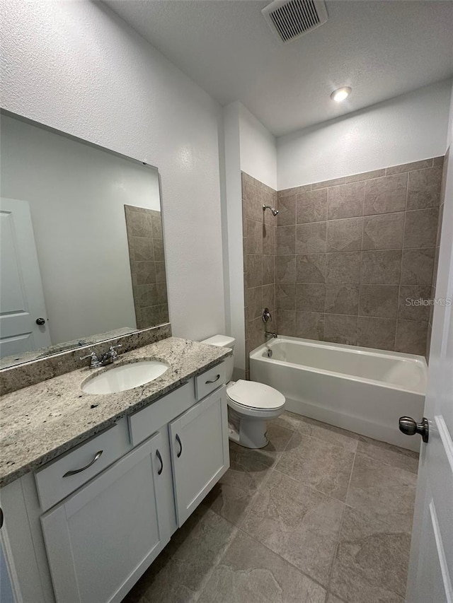 bathroom featuring shower / washtub combination, vanity, and toilet