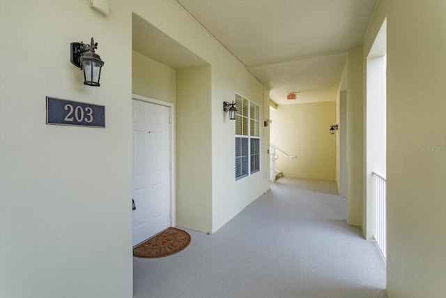 view of exterior entry with stucco siding