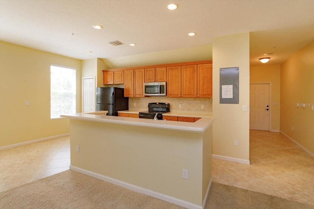 kitchen with black appliances, electric panel, light countertops, light tile patterned floors, and recessed lighting