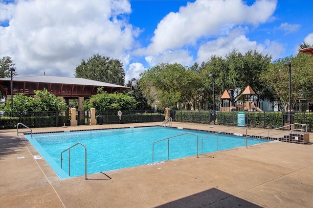 community pool featuring fence