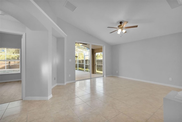 2643 Alamosa Pl, Lake Mary, FL 32746 - unfurnished room with a ceiling fan, vaulted ceiling, plenty of natural light, light tile patterned floors, and baseboards