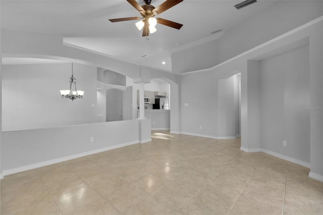 2643 Alamosa Pl, Lake Mary, FL 32746 - unfurnished living room featuring a chandelier, light tile patterned floors, ceiling fan, arched walkways, and decorative columns