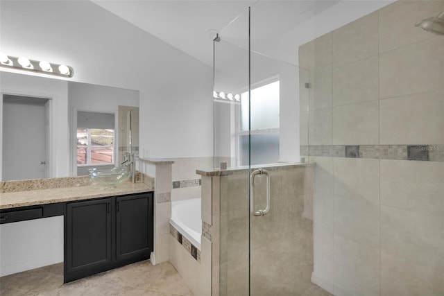 2643 Alamosa Pl, Lake Mary, FL 32746 - bathroom with a shower stall, a garden tub, vanity, and tile patterned flooring