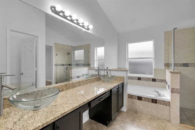 2643 Alamosa Pl, Lake Mary, FL 32746 - bathroom featuring vaulted ceiling, a stall shower, a garden tub, double vanity, and tile patterned flooring