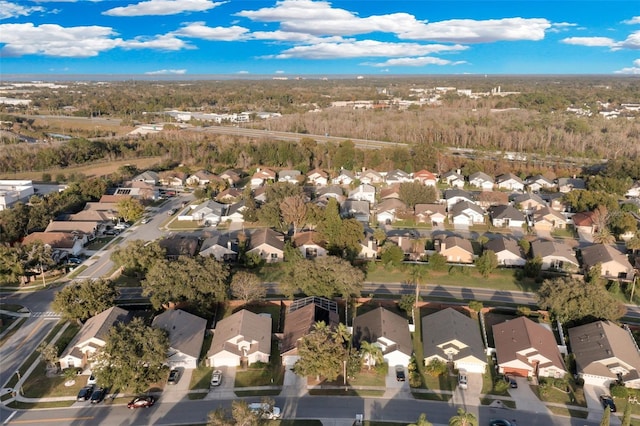 2643 Alamosa Pl, Lake Mary, FL 32746 - aerial overview of property's location with nearby suburban area and a forest