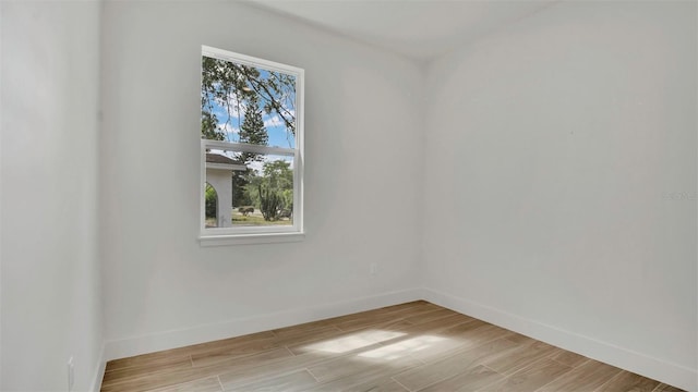 1371 Lake Dr, Casselberry, FL 32707 - spare room with baseboards and light wood-type flooring