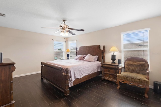 2136 J Lawson Blvd, Orlando, FL 32824 - bedroom with dark wood-type flooring, baseboards, and ceiling fan