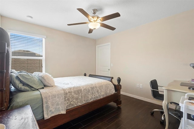 2136 J Lawson Blvd, Orlando, FL 32824 - bedroom with baseboards, dark wood-style flooring, ceiling fan, and a desk
