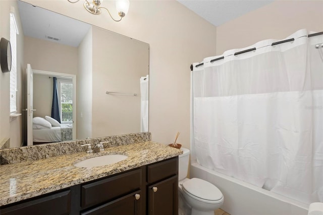 2136 J Lawson Blvd, Orlando, FL 32824 - full bathroom featuring ensuite bath, toilet, shower / bathtub combination with curtain, and vanity