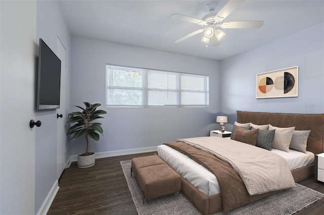 bedroom with wood finished floors, baseboards, and ceiling fan