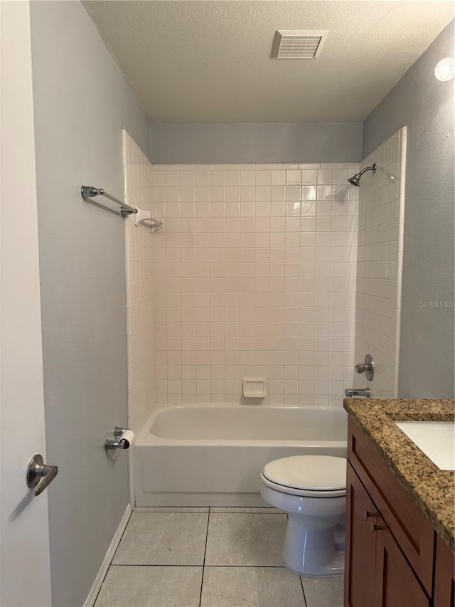 14844 Laguna Beach Cir, Orlando, FL 32824 - bathroom featuring toilet, tile patterned flooring, a textured ceiling, shower / bathtub combination, and vanity