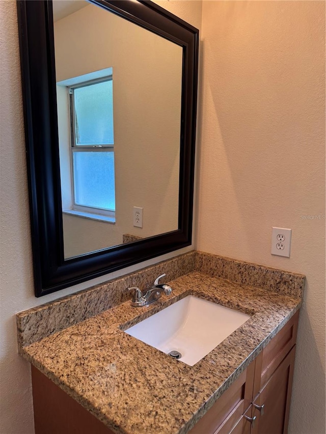 14844 Laguna Beach Cir, Orlando, FL 32824 - bathroom with vanity and a textured wall