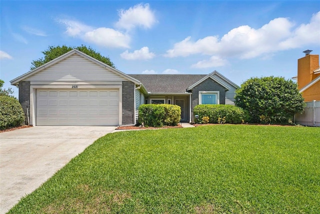 2681 Debany Rd, Kissimmee, FL 34744 - ranch-style home featuring concrete driveway, a garage, a front yard, and brick siding