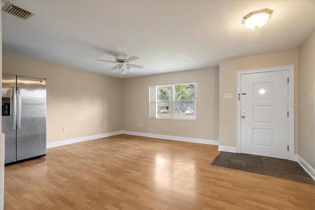 408 Eunice Dr, Plant City, FL 33563 - foyer with ceiling fan, wood finished floors, and baseboards