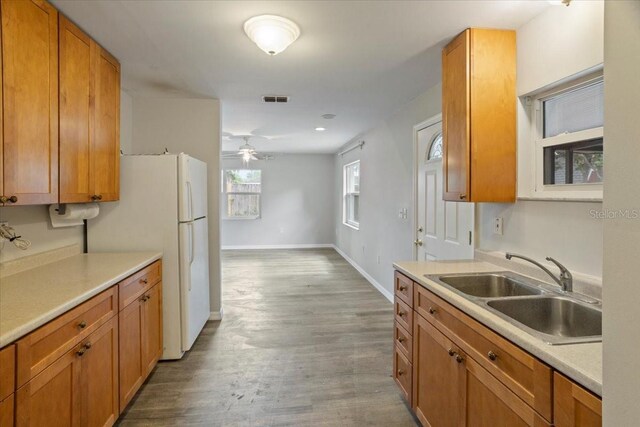 408 Eunice Dr, Plant City, FL 33563 - kitchen featuring a sink, brown cabinetry, ceiling fan, and recessed lighting