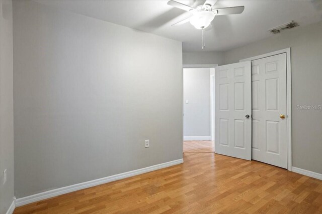 408 Eunice Dr, Plant City, FL 33563 - unfurnished bedroom featuring baseboards, light wood-style floors, and a ceiling fan