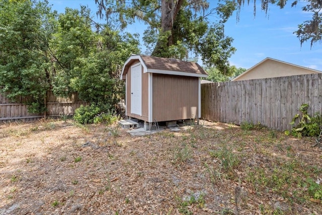 408 Eunice Dr, Plant City, FL 33563 - fenced backyard with an outdoor structure and a shed