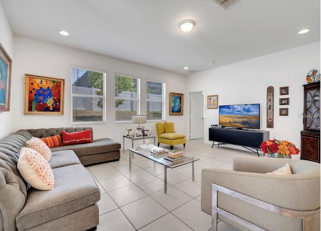 living area with light tile patterned floors and recessed lighting