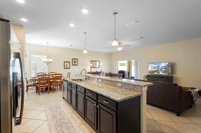 1286 Tallow Rd, Apopka, FL 32703 - kitchen featuring stainless steel appliances, a sink, open floor plan, light tile patterned floors, and recessed lighting