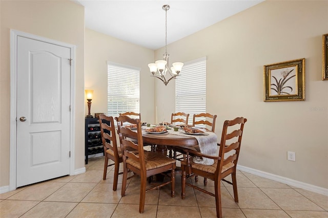 1286 Tallow Rd, Apopka, FL 32703 - dining area featuring a chandelier, light tile patterned flooring, and baseboards
