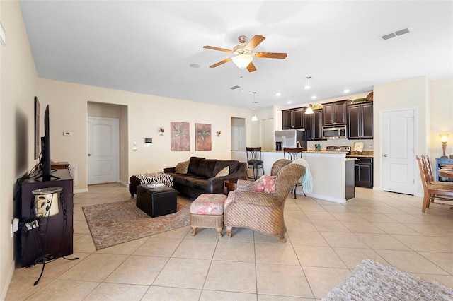 1286 Tallow Rd, Apopka, FL 32703 - living area featuring light tile patterned floors, a ceiling fan, and recessed lighting