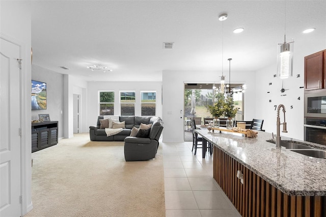 living room with light tile patterned flooring, recessed lighting, and baseboards