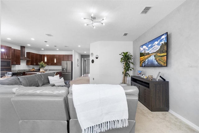 living room with light carpet, baseboards, and recessed lighting