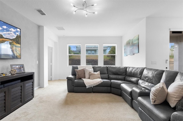 living room featuring light carpet and a chandelier