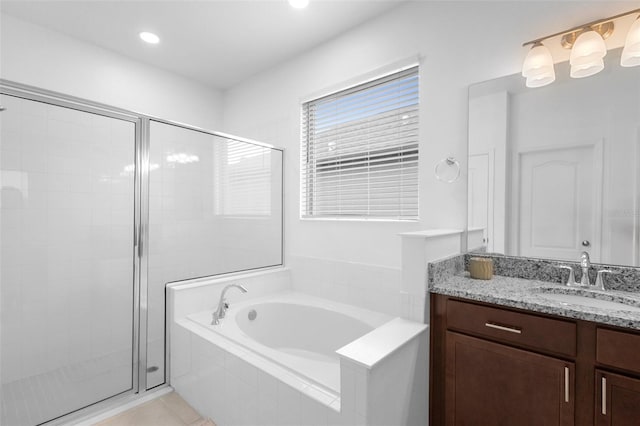 full bath featuring a shower stall, a bath, and vanity