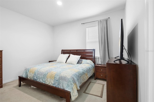carpeted bedroom featuring baseboards