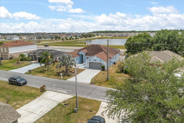 aerial view of residential area with a large body of water