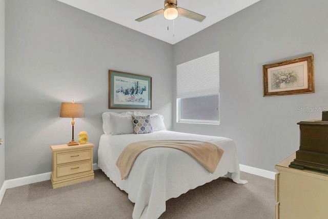 carpeted bedroom with baseboards and ceiling fan