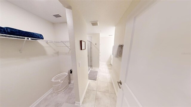 3150 Paradox Cir Unit 102, Kissimmee, FL 34746 - spacious closet featuring light tile patterned flooring