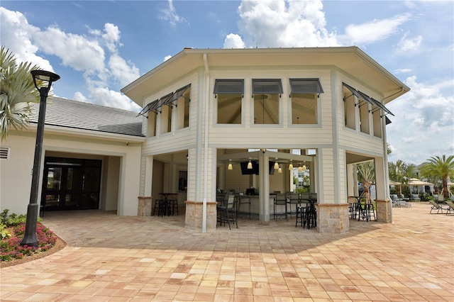 3150 Paradox Cir Unit 102, Kissimmee, FL 34746 - back of property with a patio