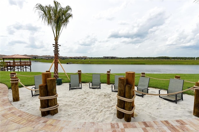 3150 Paradox Cir Unit 102, Kissimmee, FL 34746 - view of home's community featuring a gazebo, a water view, a fire pit, and a yard