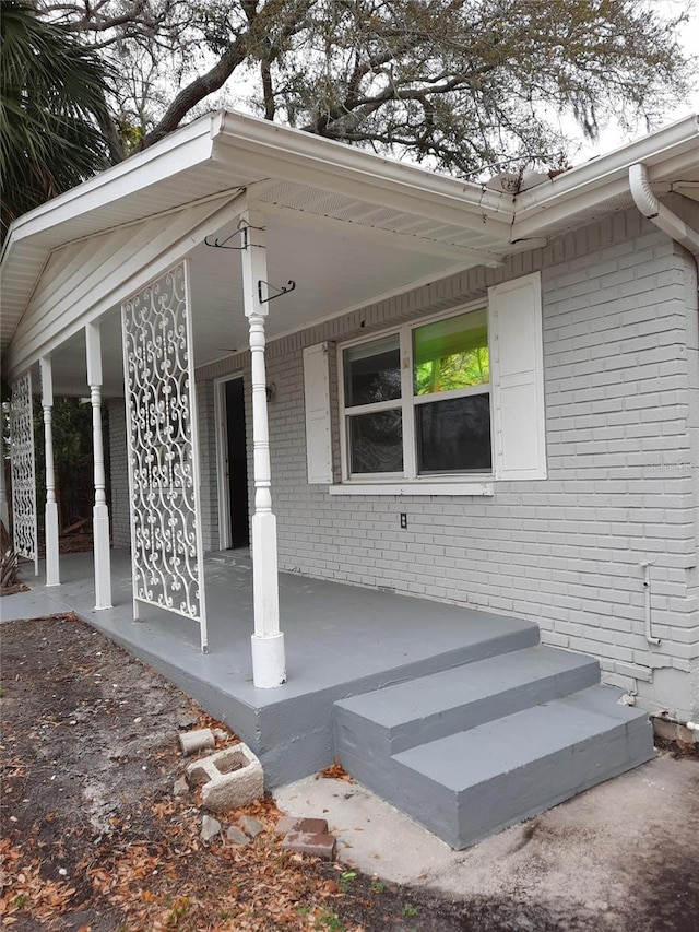 7240 Donna Dr, New Port Richey, FL 34652 - view of patio with a porch