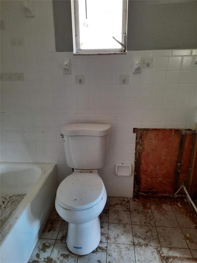 7240 Donna Dr, New Port Richey, FL 34652 - full bath with tile walls, toilet, a bath, and a shower