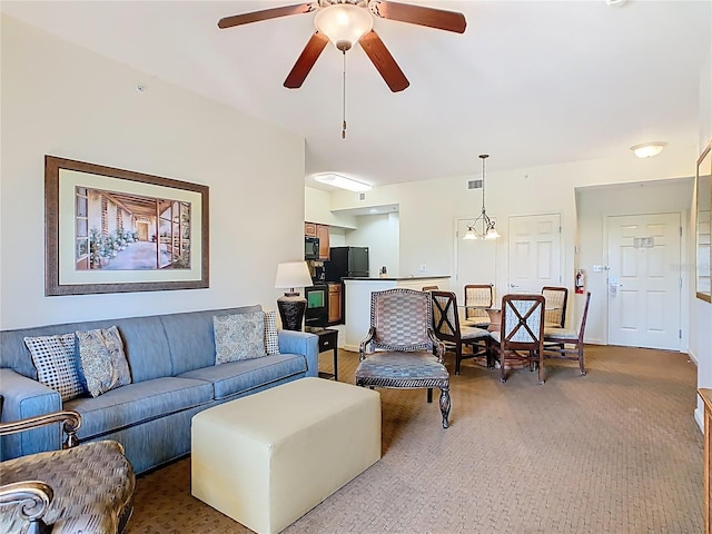 8101 Resort Village Dr, Orlando, FL 32821 - living room with light colored carpet and a ceiling fan