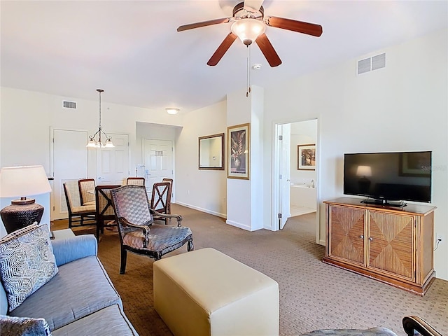 8101 Resort Village Dr, Orlando, FL 32821 - carpeted living room with ceiling fan and baseboards