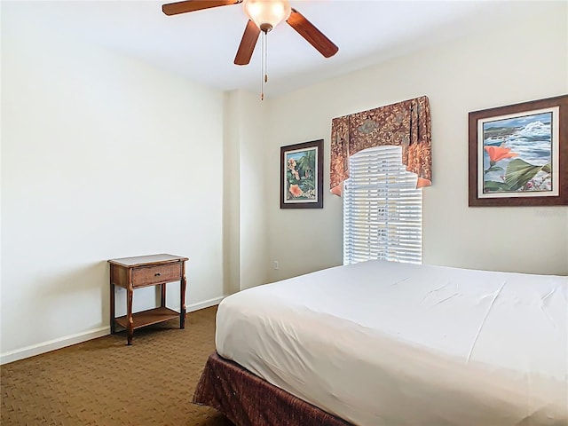 8101 Resort Village Dr, Orlando, FL 32821 - bedroom with carpet flooring, baseboards, and a ceiling fan