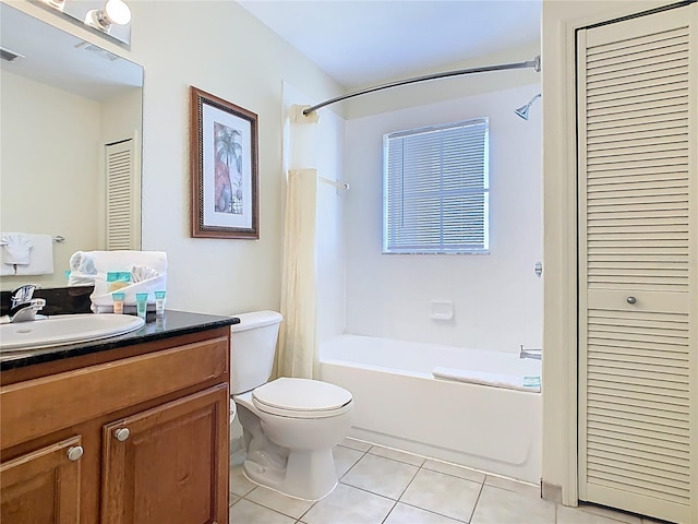8101 Resort Village Dr, Orlando, FL 32821 - full bath featuring a closet, tile patterned floors, toilet, shower / bath combo, and vanity