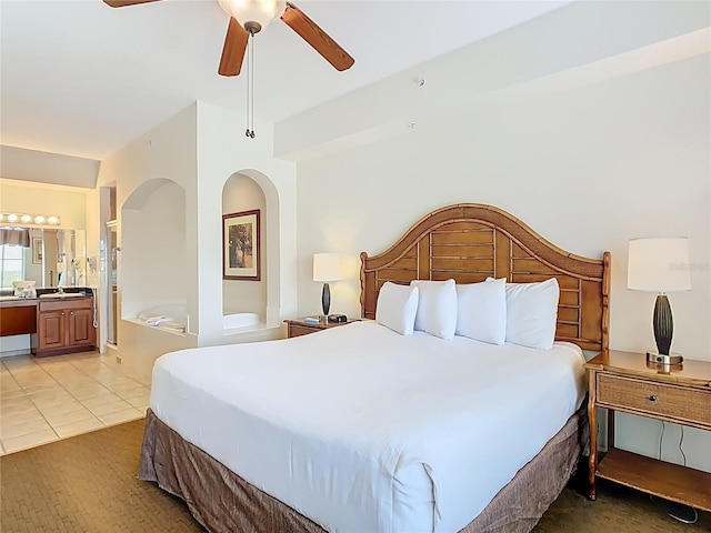 8101 Resort Village Dr, Orlando, FL 32821 - bedroom featuring ensuite bath, light tile patterned flooring, and a ceiling fan