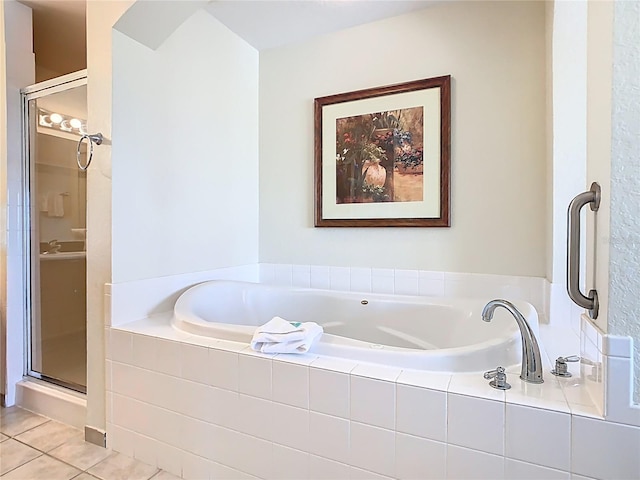 8101 Resort Village Dr, Orlando, FL 32821 - full bathroom featuring tile patterned flooring, a stall shower, and a bath
