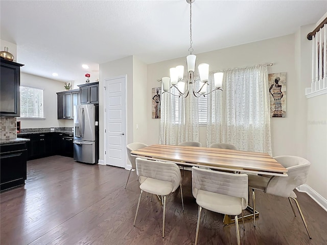 473 Oviedo Blvd, Oviedo, FL 32765 - dining area featuring a chandelier, dark wood-style floors, and baseboards