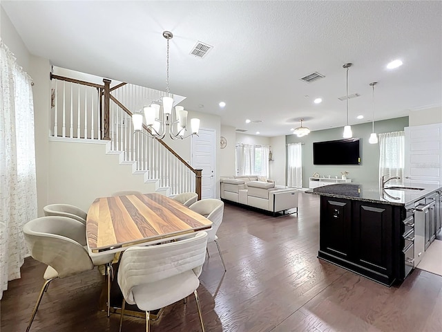 473 Oviedo Blvd, Oviedo, FL 32765 - dining space featuring plenty of natural light, a chandelier, dark wood-style flooring, stairway, and recessed lighting