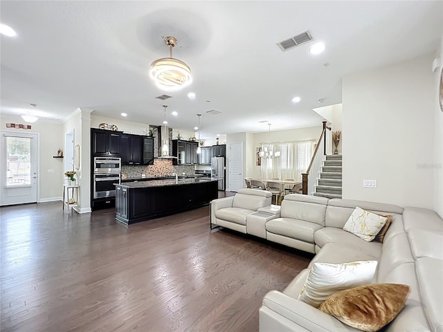 473 Oviedo Blvd, Oviedo, FL 32765 - living room with healthy amount of natural light, stairway, dark wood-style floors, baseboards, and recessed lighting