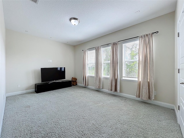 473 Oviedo Blvd, Oviedo, FL 32765 - unfurnished living room with carpet, baseboards, and a textured ceiling