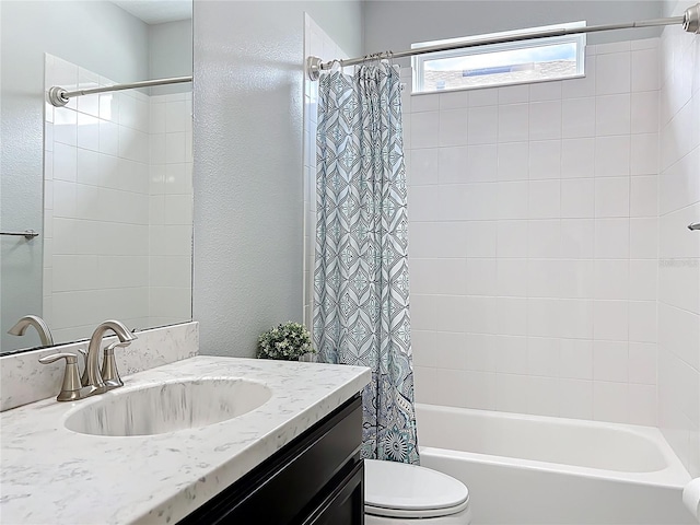 473 Oviedo Blvd, Oviedo, FL 32765 - bathroom featuring toilet, shower / bath combo with shower curtain, vanity, and a textured wall