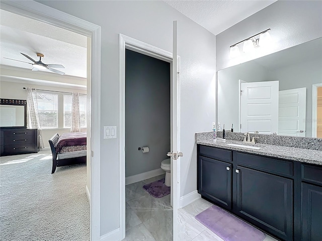473 Oviedo Blvd, Oviedo, FL 32765 - full bath with toilet, vanity, ceiling fan, a textured ceiling, and baseboards